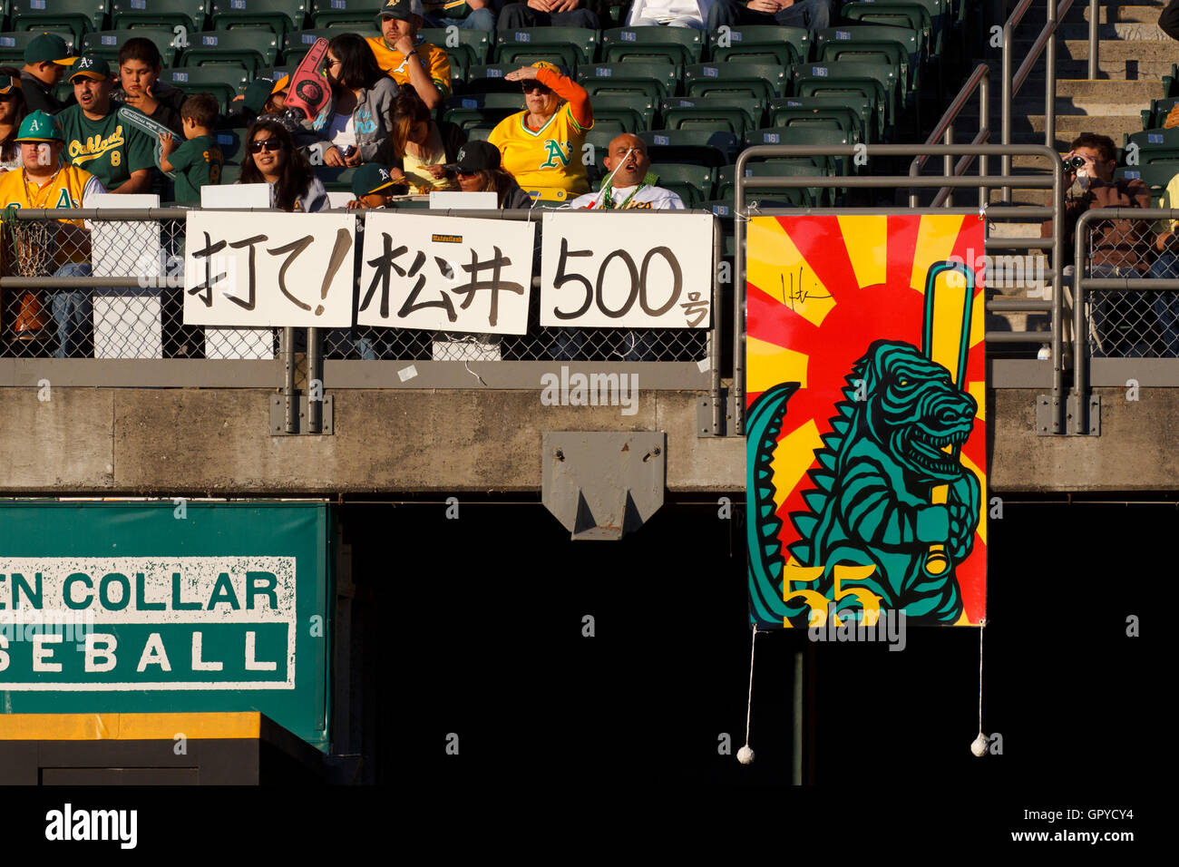 June 29, 2011; Oakland, CA, USA; Fans of Oakland Athletics designated hitter Hideki Matsui (not pictured) hang signs in anticipation of his 500th professional career home run during the first inning against the Florida Marlins the game at the O.co Coliseu Stock Photo