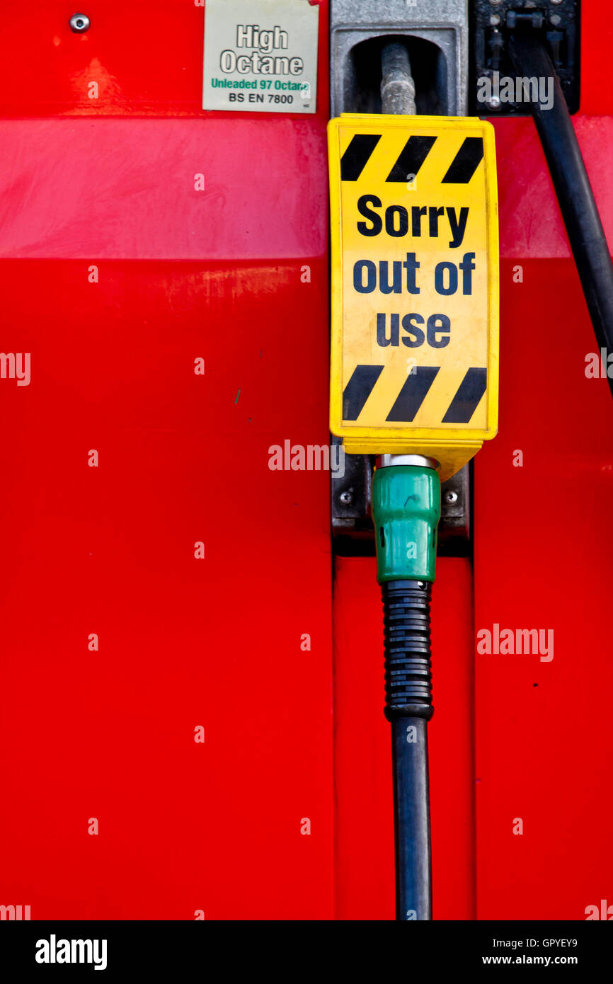 Petrol pump with sorry out of use sign attached to the handle Stock Photo