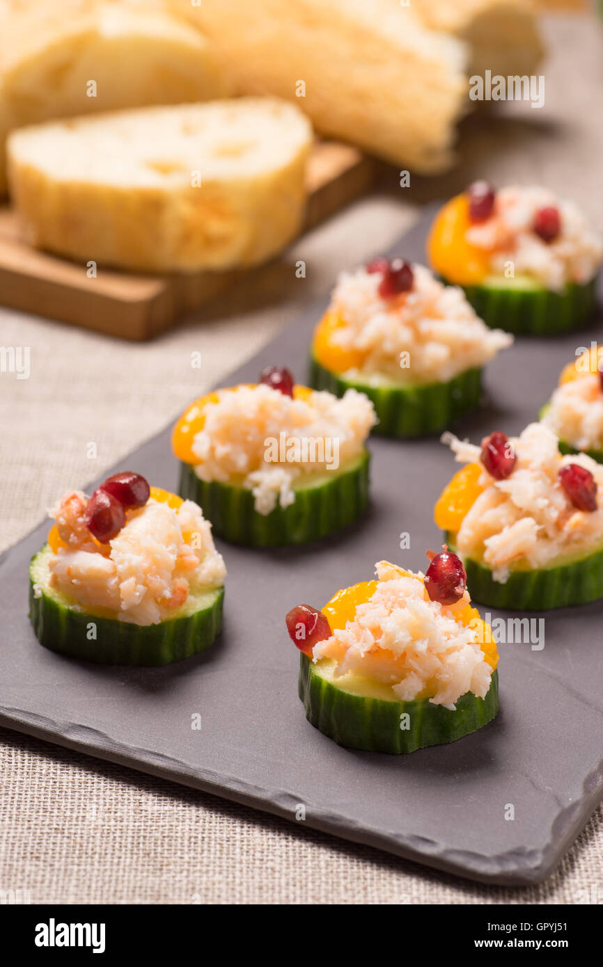 Crab meat appetizer served on Cucumber slices Stock Photo Alamy
