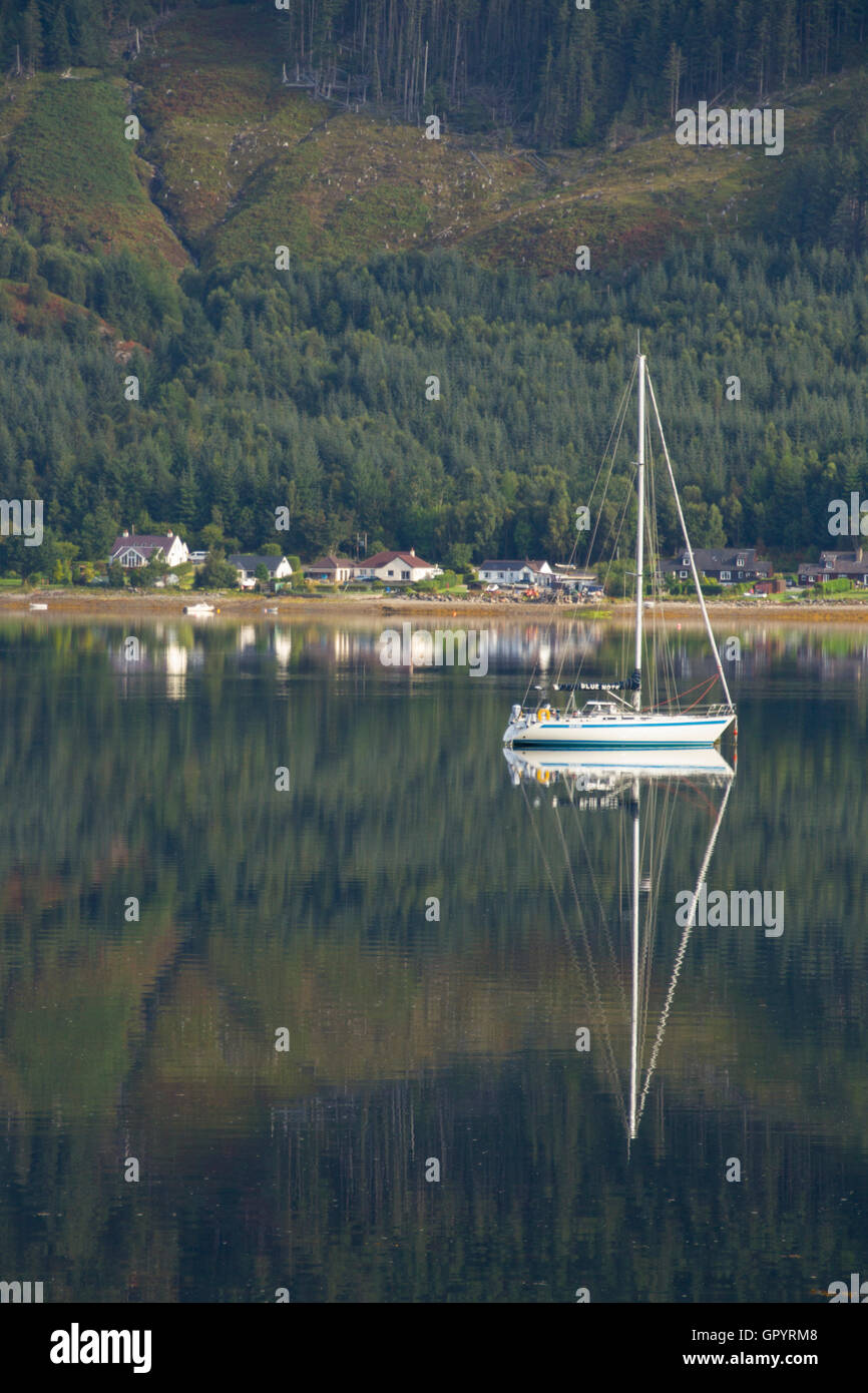 Sailing boat on tranquil Loch Duich in the Highland of Scotland Stock Photo