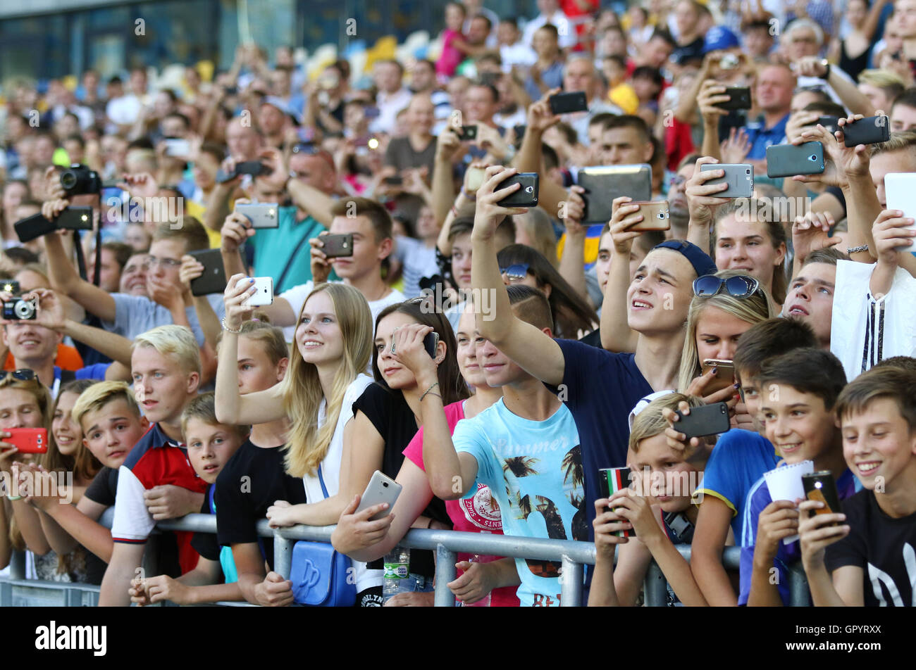 Young football supporters watch the Open training session of Ukraine National Football Team Stock Photo