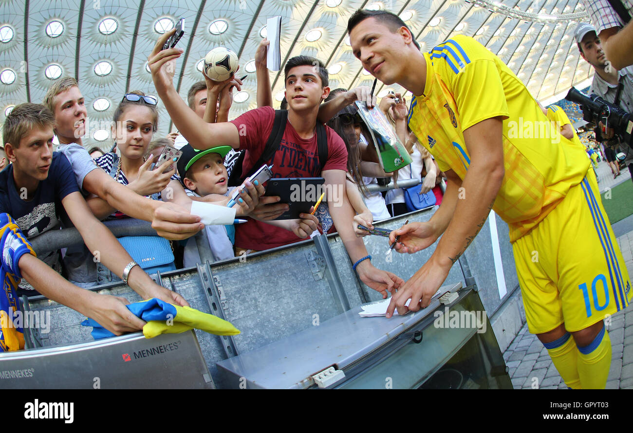 Player Yevhen Konoplyanka gives an autographs during Open training session of Ukraine National Football Team Stock Photo