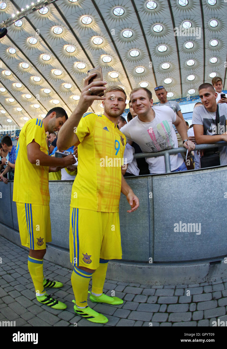 Player Roman Bezus makes selfie with fans during Open training session of Ukraine National Football Team Stock Photo