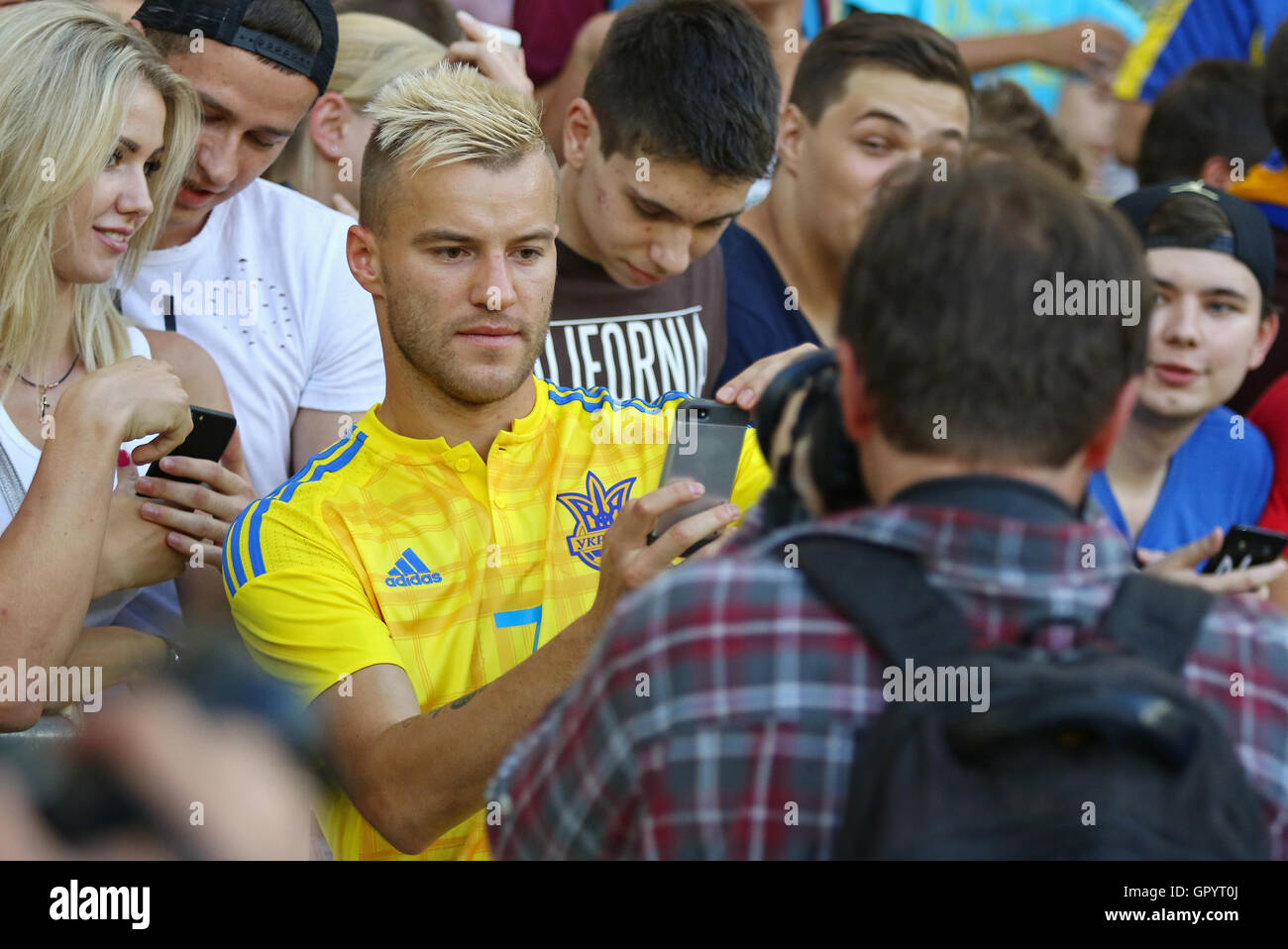 Player Andriy Yarmolenko makes selfie with fans during Open training session of Ukraine National Football Team Stock Photo