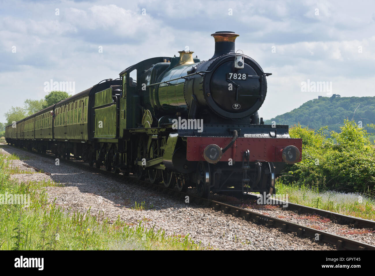 Steam engine 7828 Odney Manor pulling a train towards the West Somerset Railway Station at Minehead in Somerset Stock Photo