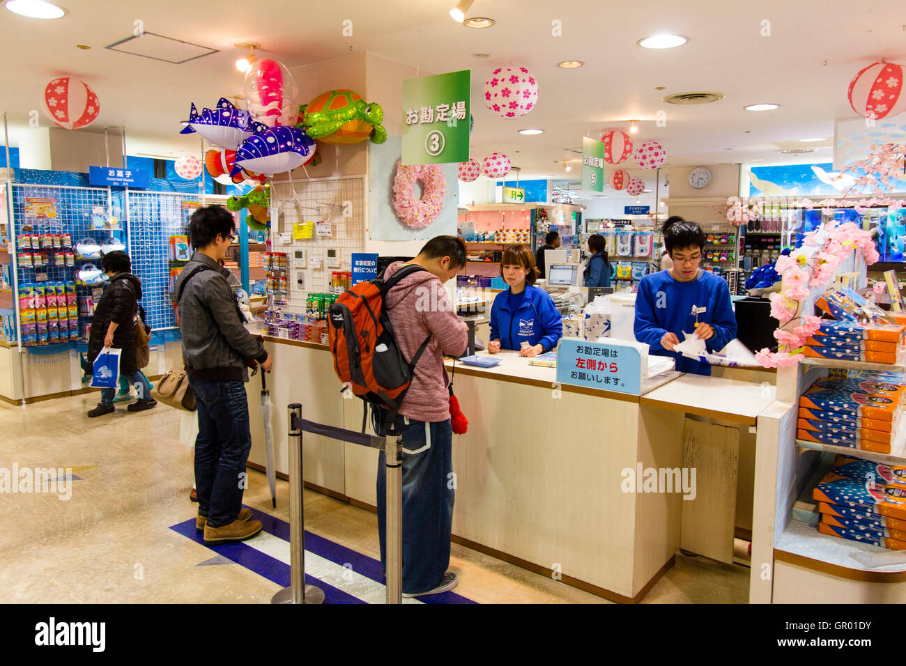 Interior Of The Gift Shop At The Osaka Aquarium Kaiyukan Man Looking Down As He Takes Money From His Wallet While Being Served By Woman Cashier Stock Photo Alamy Interior Of The Gift Shop At The Osaka Aquarium Kaiyukan Man Looking Down As He Takes Money From His Wallet While Being Served By Woman Cashier Stock Photo Alamy