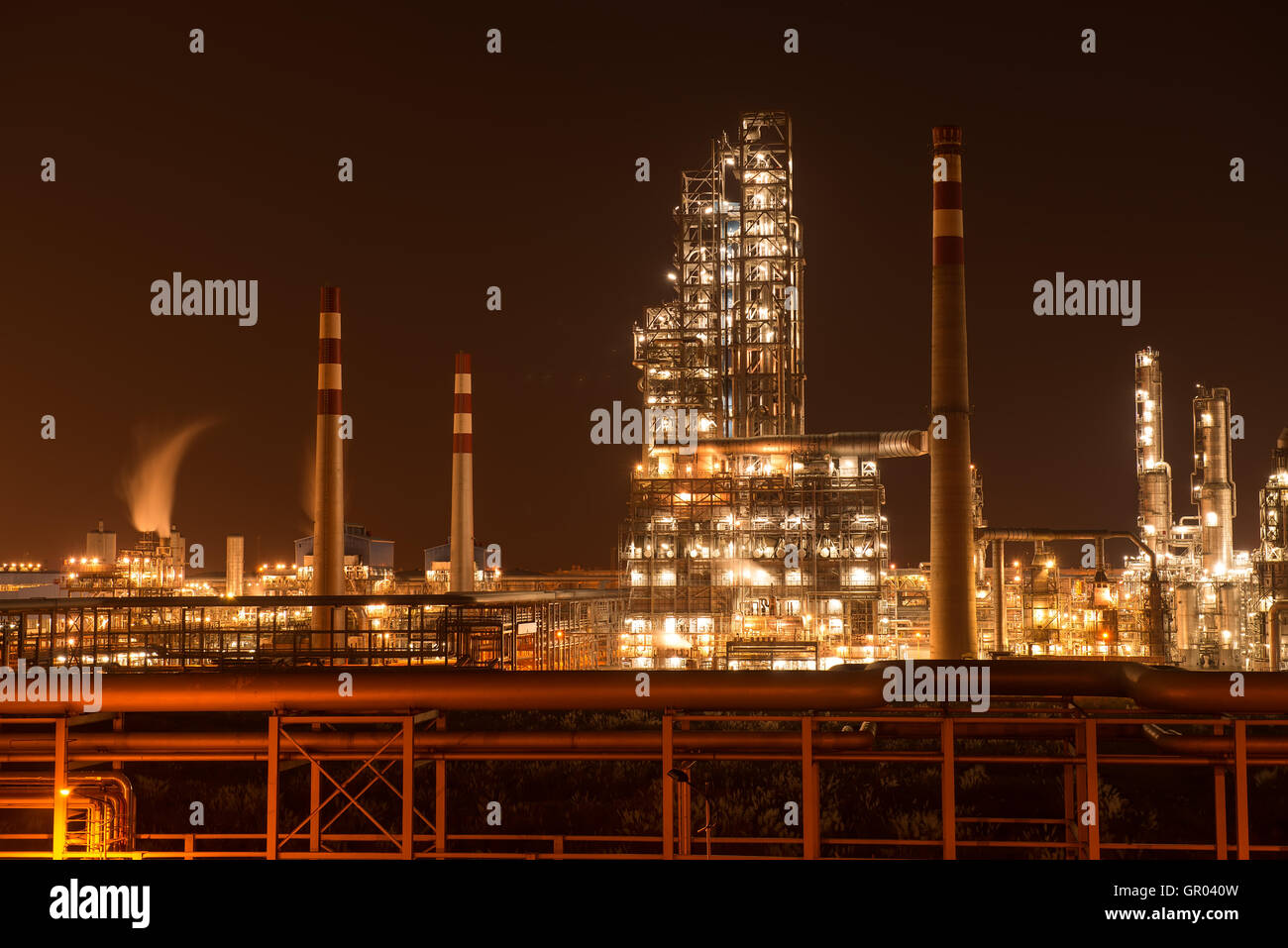 Refinery industrial plant with Industry boiler at night Stock Photo - Alamy