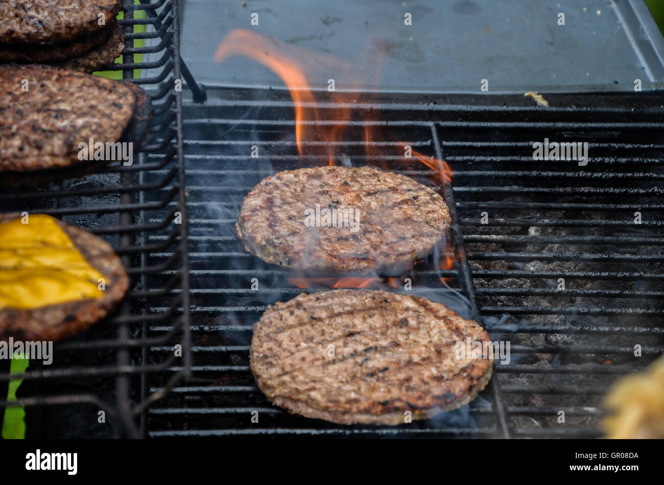 Portrush, Northern Ireland August 24th 2013 burgers cooking on a gas