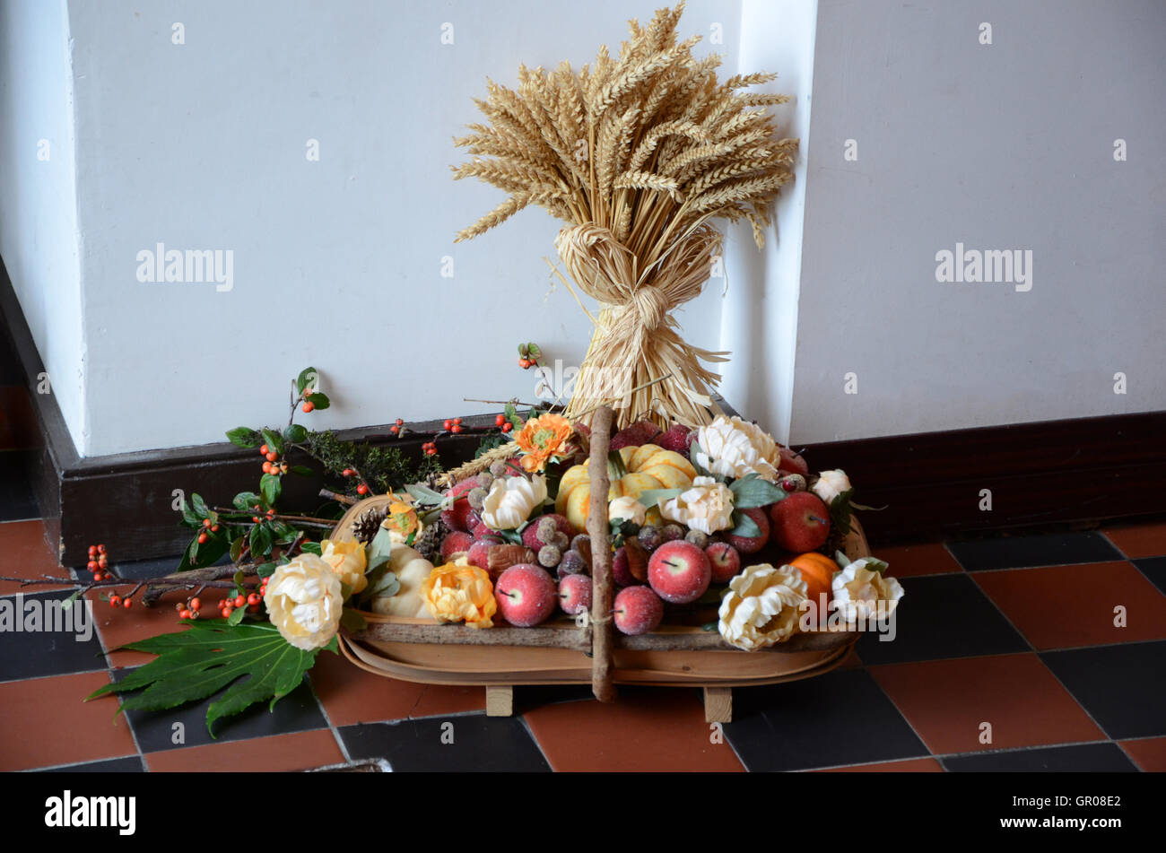 Portrush , Northern Ireland - October 20th, 2013. Picture shows a  Church Harvest decoration containing flowers fruits and wheat Stock Photo