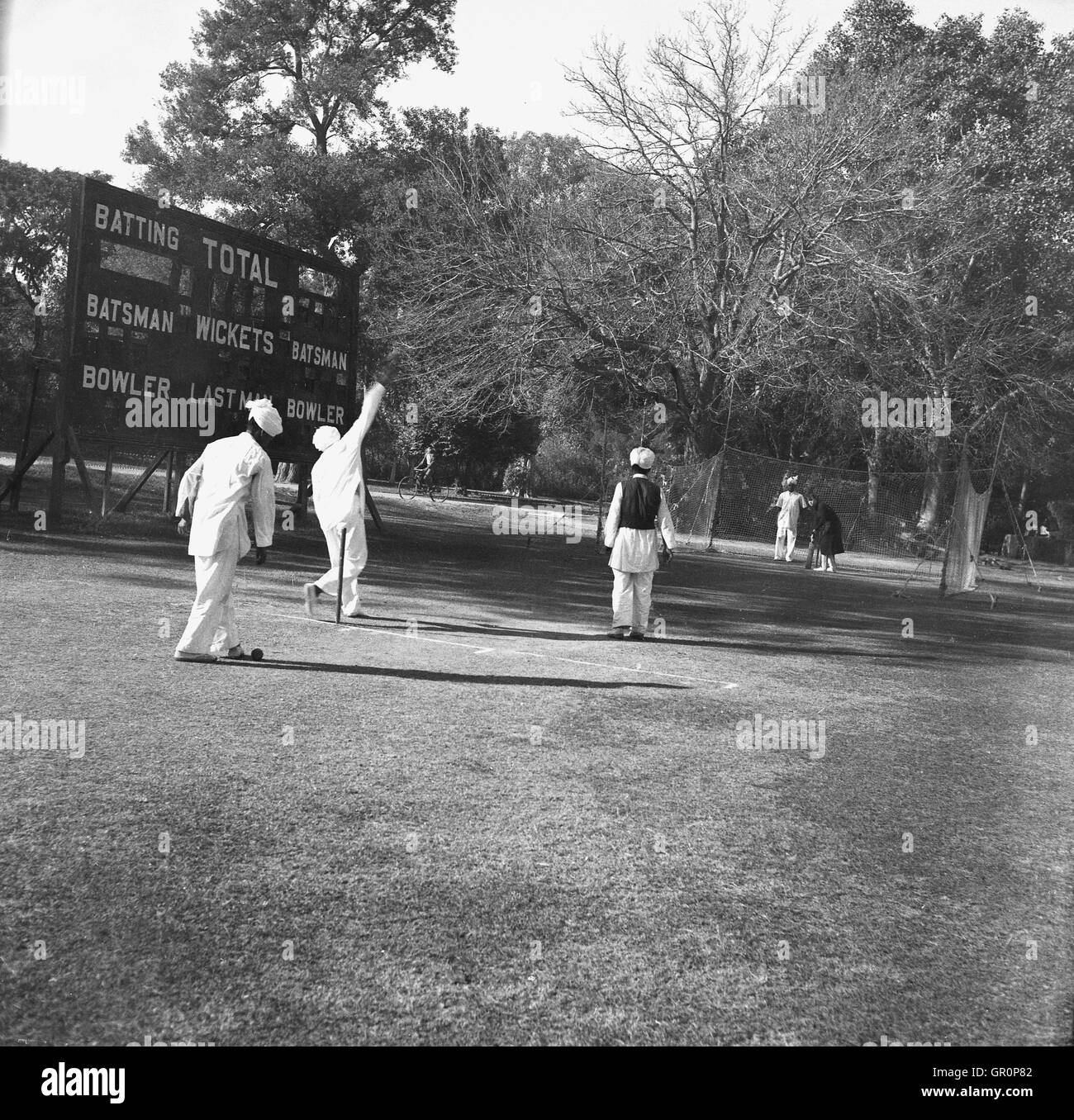 1930s, historical, local cricket match in Lahore, Pakistan. Practicising in the nets. Stock Photo