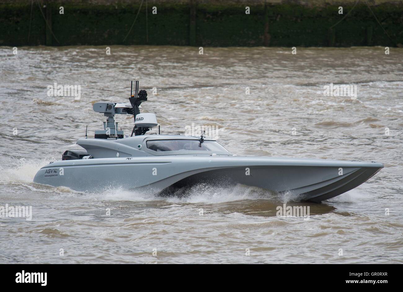 The Maritime Autonomy Surface Testbed (MAST), an unmanned surface vessel (USV) is tested on the River Thames, London, as part of preparations for the Royal Navy's 'Unmanned Warrior' test program this autumn. Stock Photo