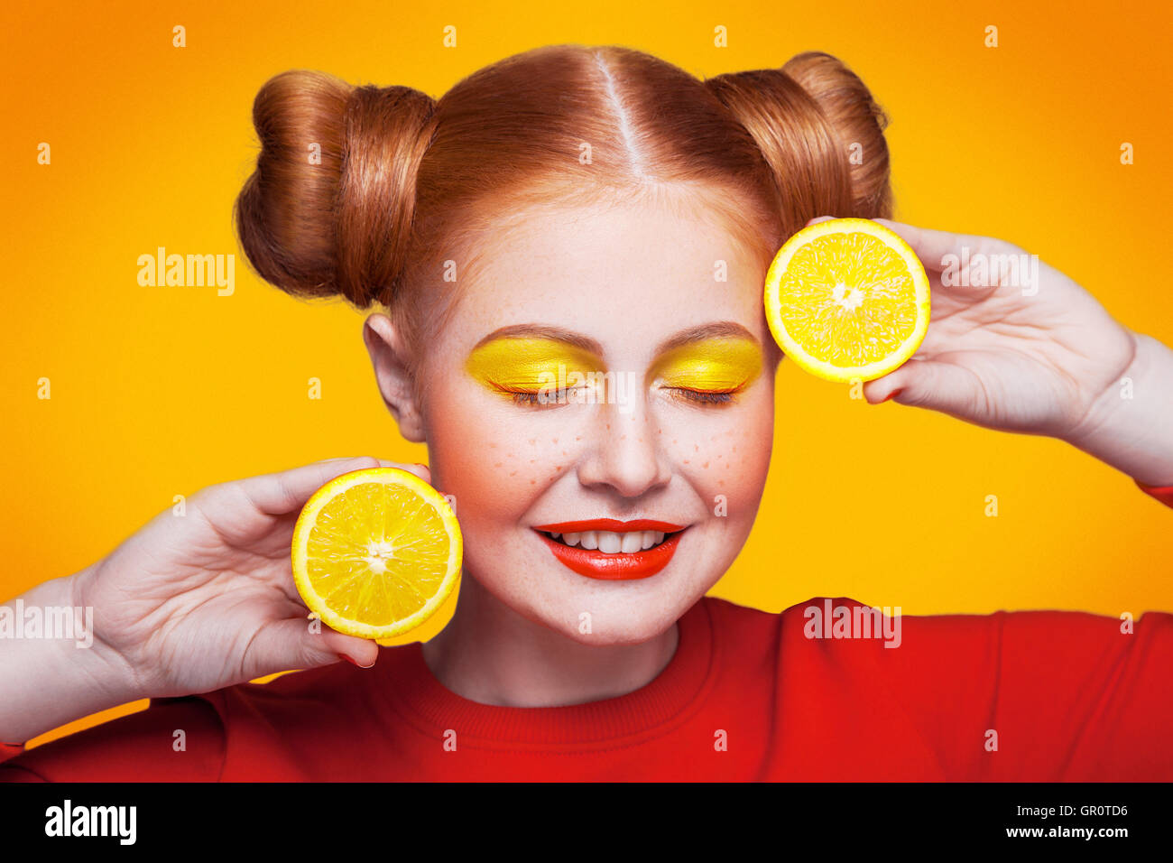 Young beautiful fashion model with Lemon. studio shot. Stock Photo