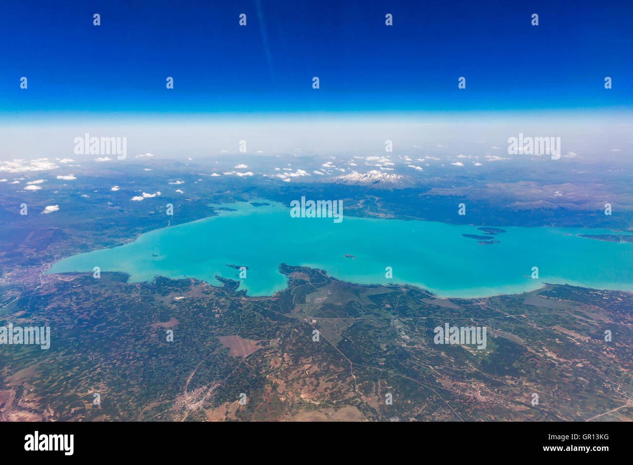 Aerial view from airplane of Lake Beysehir and snow covered mountains