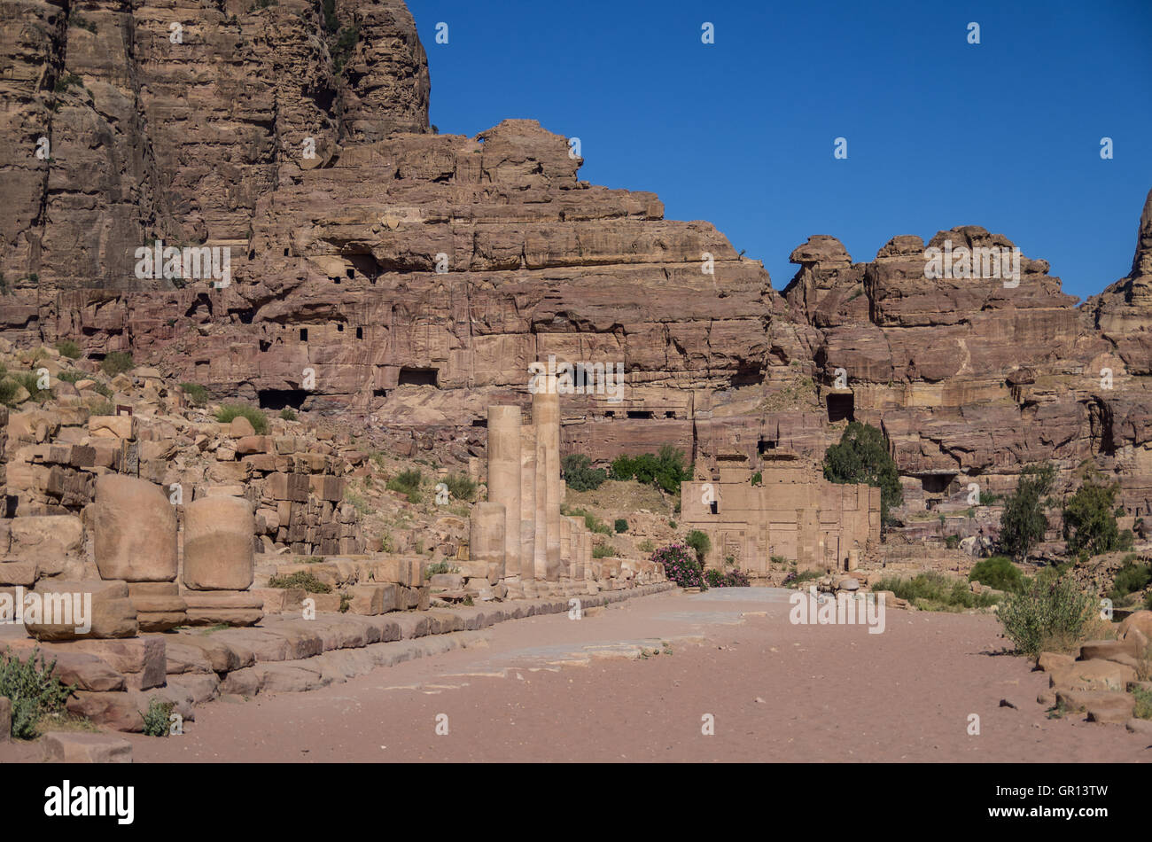 The Hadrian (Temenos) Gate and the Cardo Maximus in Petra. Qasr al-Bint at background. Petra, Jordan Stock Photo