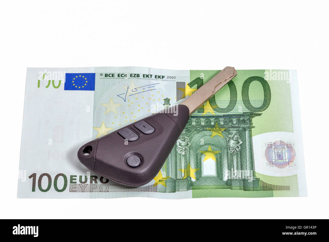 one hundred euros banknote and car keys isolated on white closeup with copy space Stock Photo