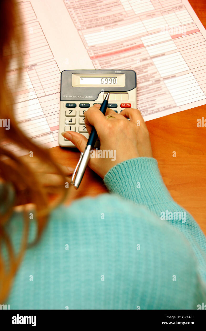 Tax calculating hi-res stock photography and images - Alamy