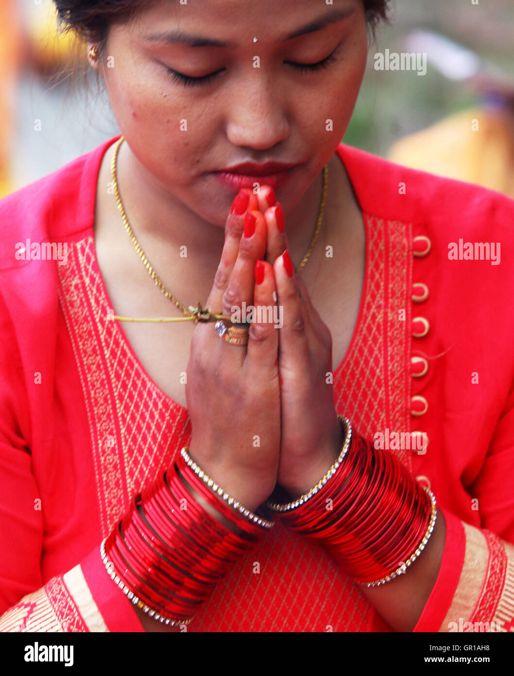 Kathmandu, Nepal. 6th Sep, 2016. A Hindu woman offers prayers during the Rishi Panchami festival in Kathmandu, Nepal, Sept. 6, 2016. Rishi Panchami festival marks the end of the three-day Teej festival when women worship Sapta Rishi (Seven Saints) and pray for health for their husband while unmarried women wish for handsome husband and happy conjugal lives. © Sunil Sharma/Xinhua/Alamy Live News Stock Photo