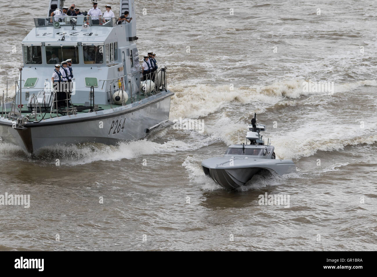 London, UK. 5th September 2016. The Maritime Autonomy Surface Testbed (MAST), an unmanned surface vessel (USV) which is a special type of military drone is tested on the River Thames near Tower Bridge as part of preparations for the Royal Navy's 'Unmanned Warrior' test program this autumn. The drone boat, known as Bladerunner was accompanied by HMS Archer. Credit: Vickie Flores/Alamy Live News Stock Photo