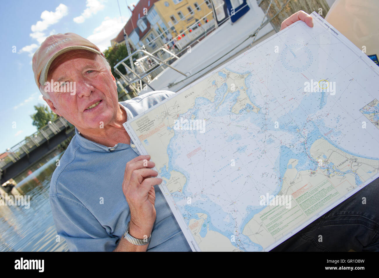 Stralsund, Germany. 6th Sep, 2016. Sailor Andreas Kohl presenting a map of Greifswalder Bodden on his boat in the harbour of Stralsund, Germany, 6 September 2016. According to the 72-year-old, he was travelling on his seven meter long boat between Ruegen and Stralsund when he hit a humpback whale. The German Oceanographic Museum in Stralsund already reported 20 sightings of the ten mter long animal since the end of July. PHOTO: STEFAN SAUER/dpa/Alamy Live News Stock Photo