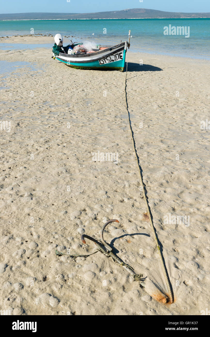 Fishing boat with anchor at low tide on the beach, Churchhaven, West