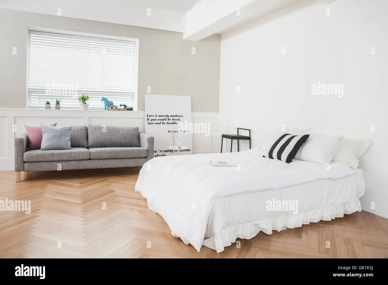 Interior with sofa and bed Stock Photo Alamy