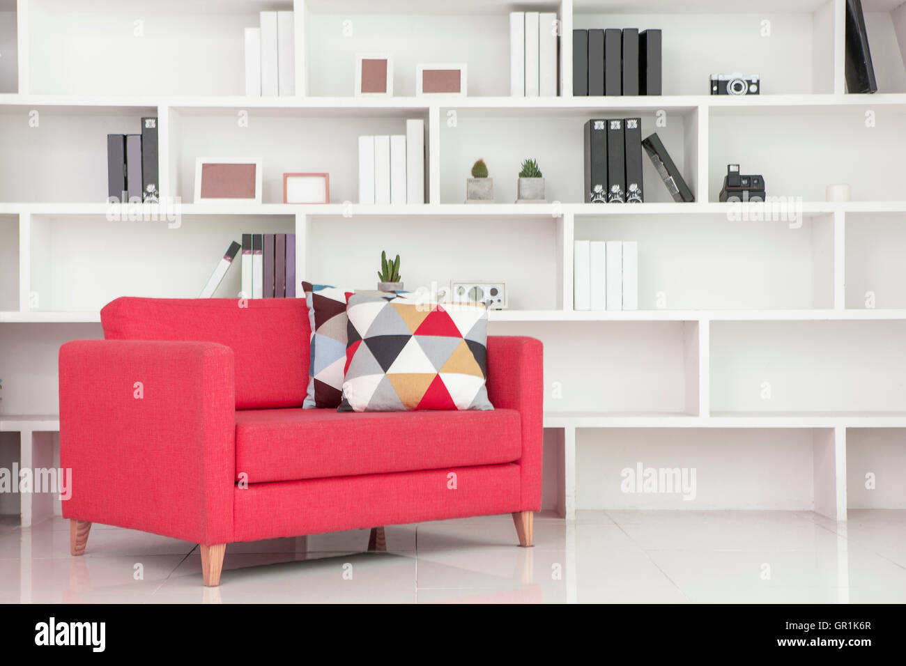 Interior with bookcases and sofa Stock Photo - Alamy