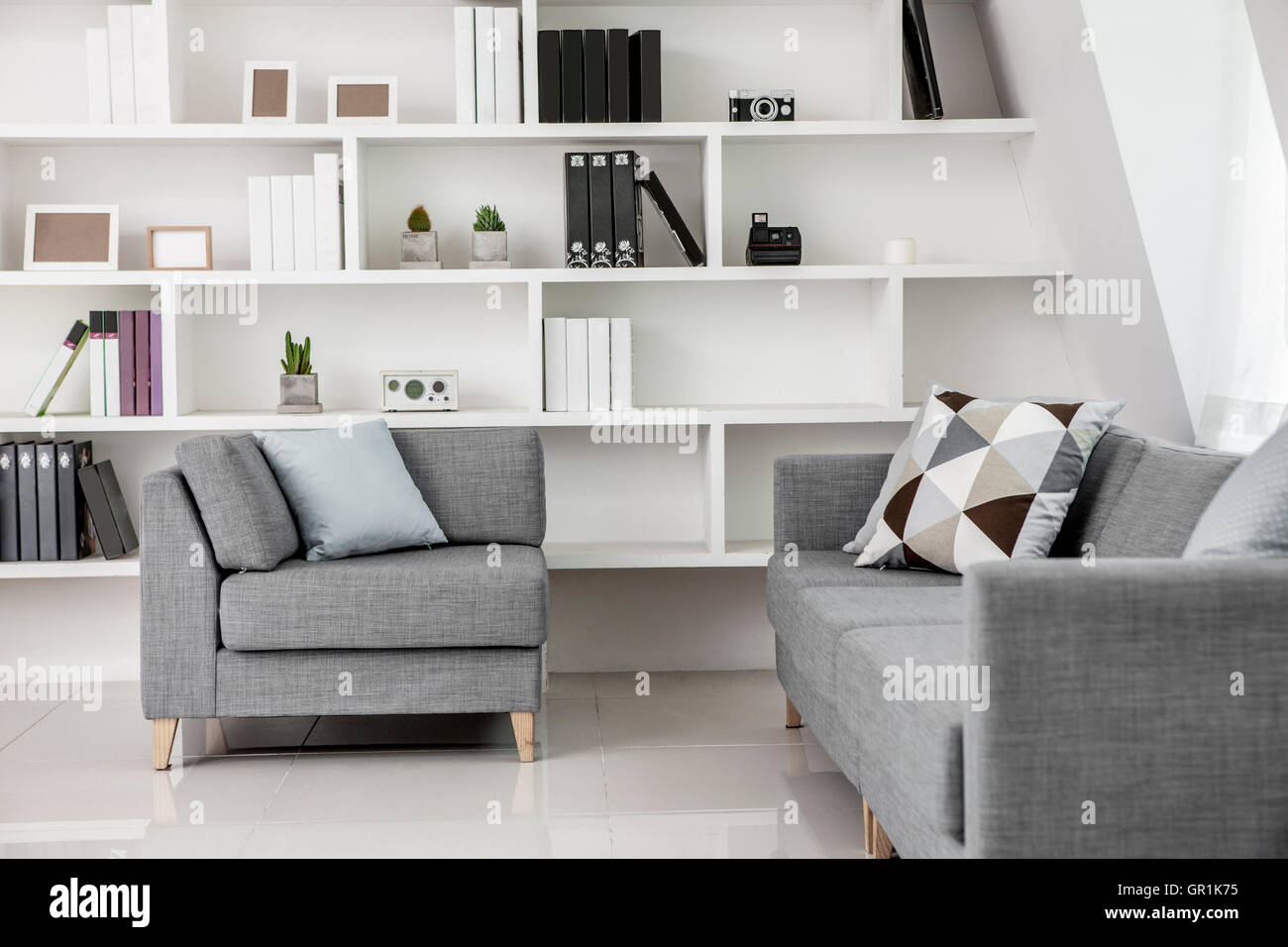 Interior with bookcases and sofa Stock Photo - Alamy
