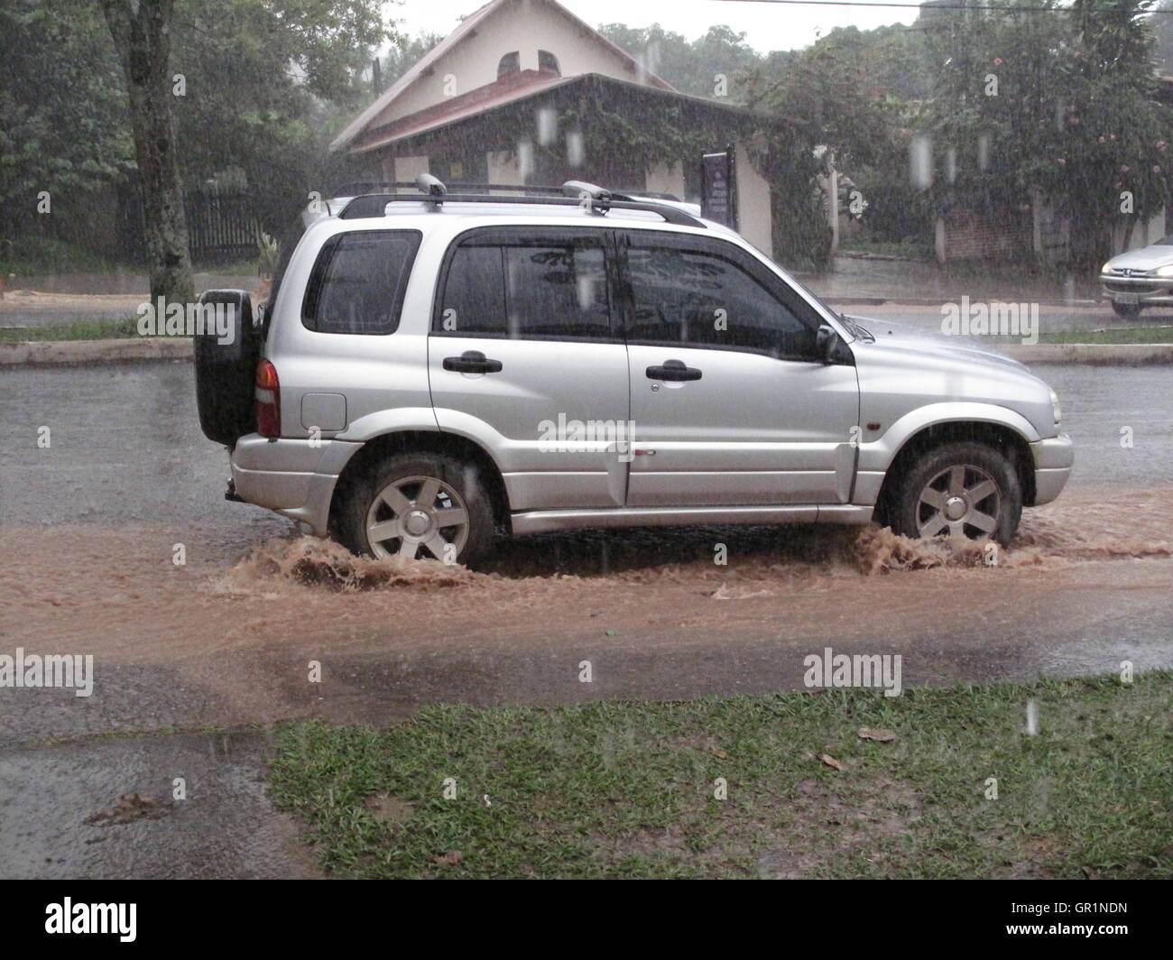 car in the rain,water in street,Brazil,Goias Stock Photo