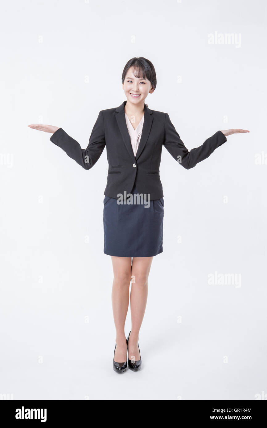 Smiling businesswoman standing arms hi-res stock photography and images ...