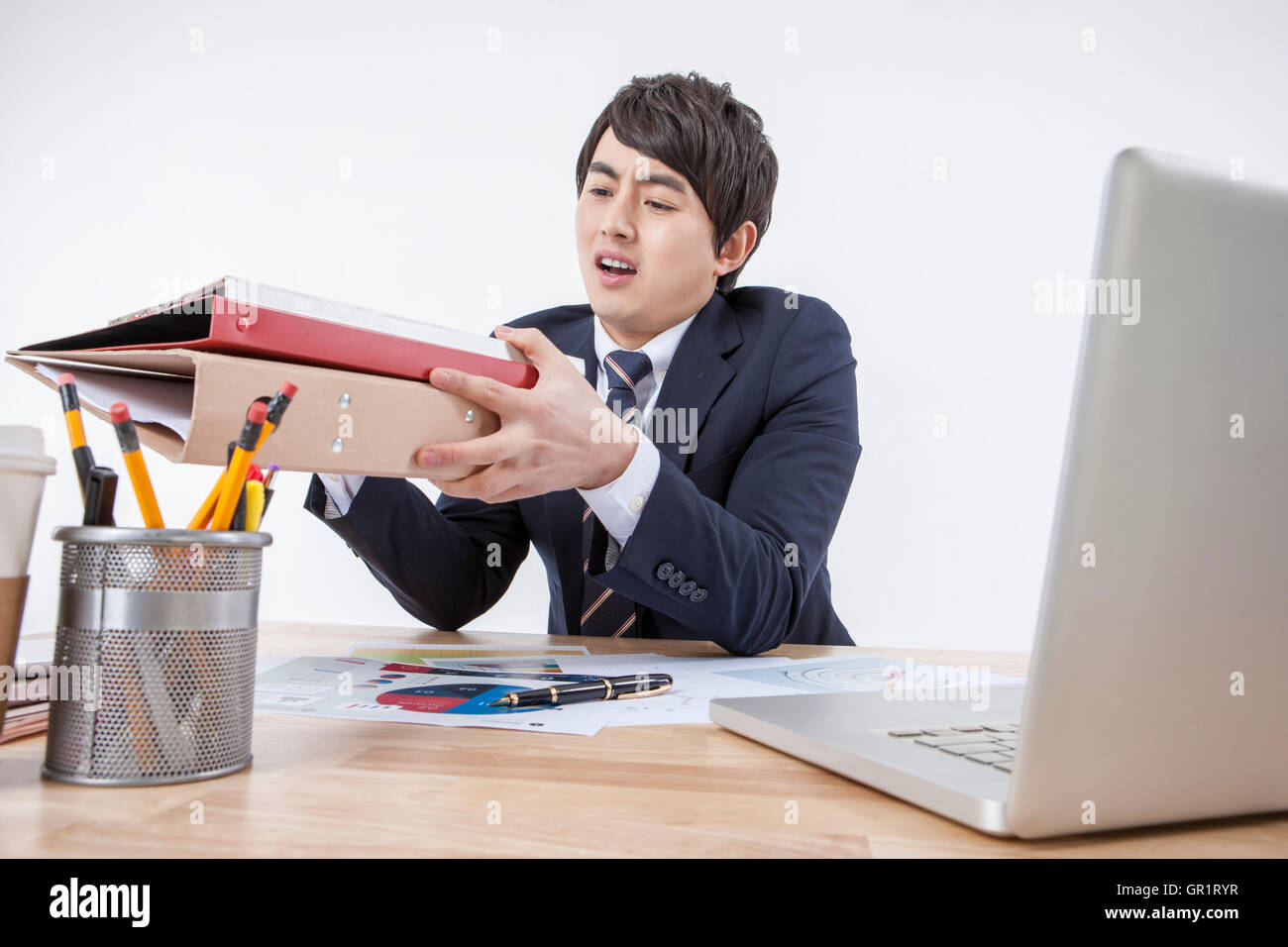 Stressful businessman at work Stock Photo