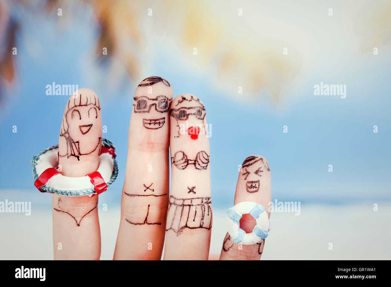 Harmonious family on vacation by finger art Stock Photo