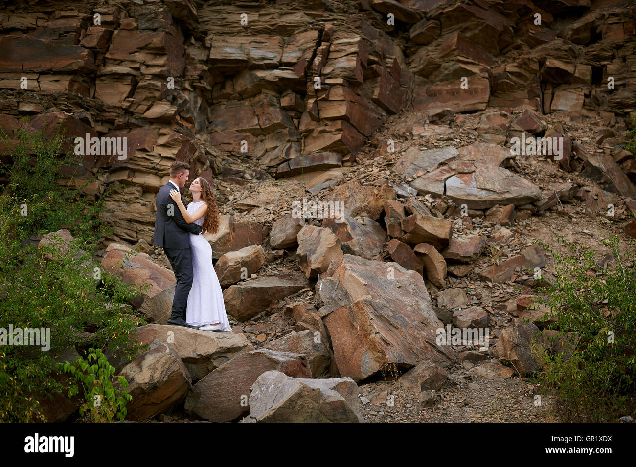 young couple in love on the background of mountains Stock Photo