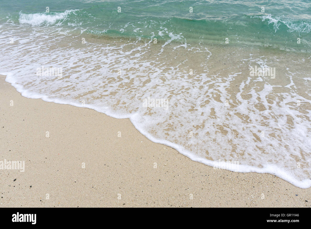 Beautiful waves on sandy beach hi-res stock photography and images - Alamy