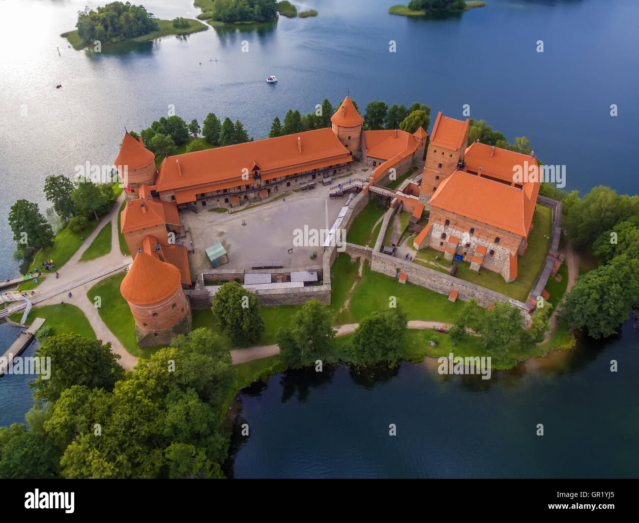 Trakai, Lithuania: aerial UAV top view, flat lay of Island Castle in the sunset. Historical residence in capital city of Grand D Stock Photo