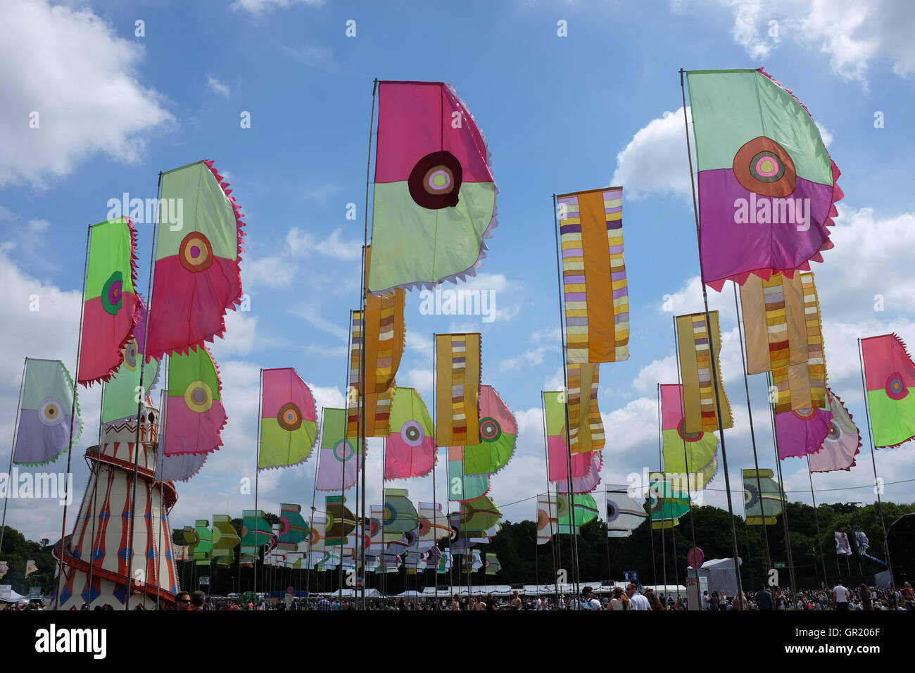 Festival flags blowing in the wind against a cloudy blue sky Stock ...