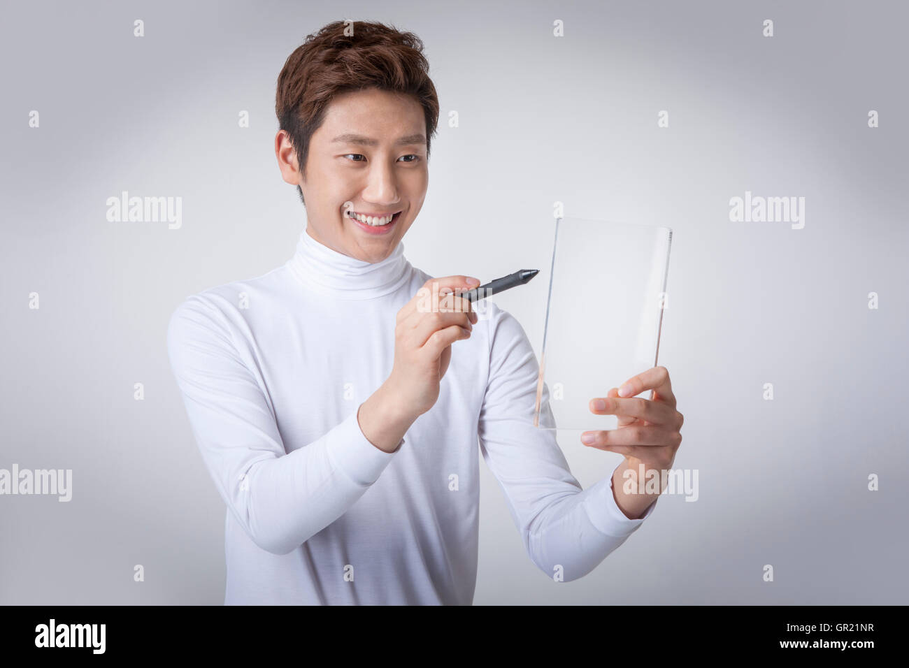 Young man touching screen Stock Photo