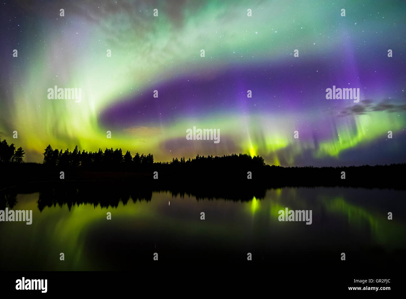 Northern Lights over a lake in Oulu, Finland Stock Photo - Alamy