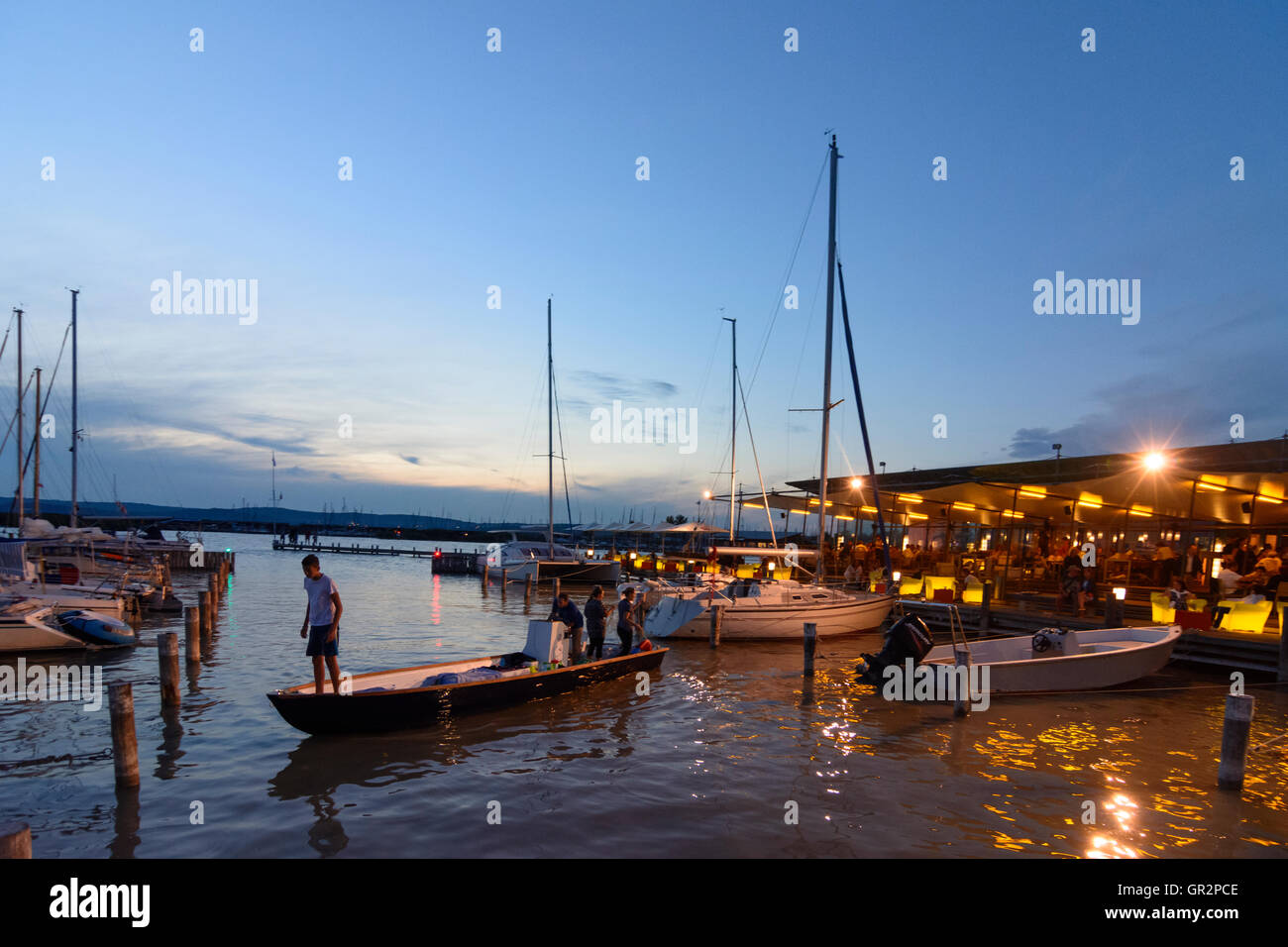 Neusiedl am See: restaurant bar marina sailboat 'Mole West' at night, Lake Neusiedl, Neusiedler See, Austria, Burgenland, Stock Photo