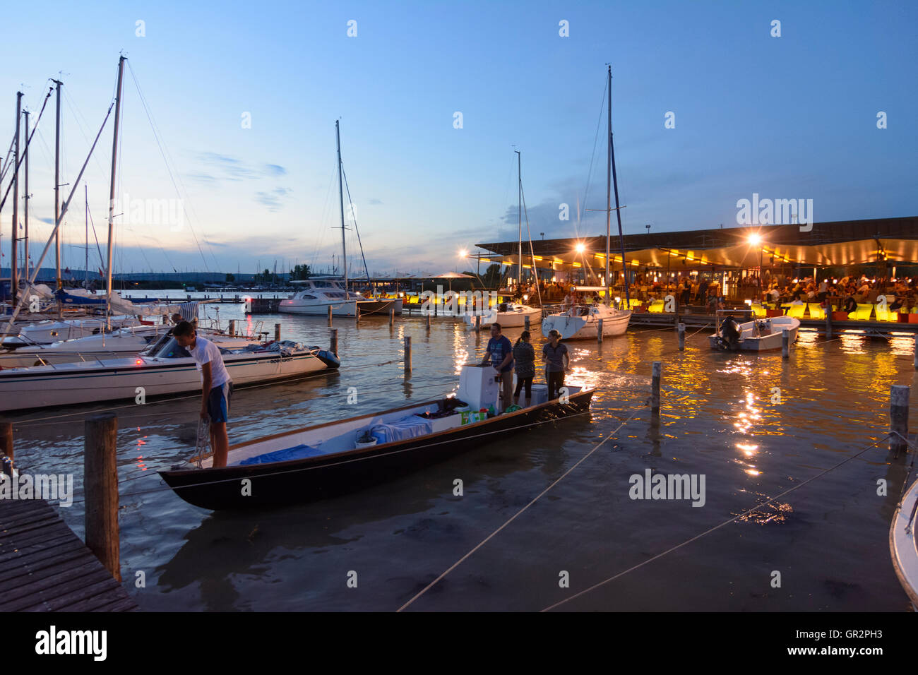 Neusiedl am See: restaurant bar marina sailboat 'Mole West' at night, Lake Neusiedl, Neusiedler See, Austria, Burgenland, Stock Photo