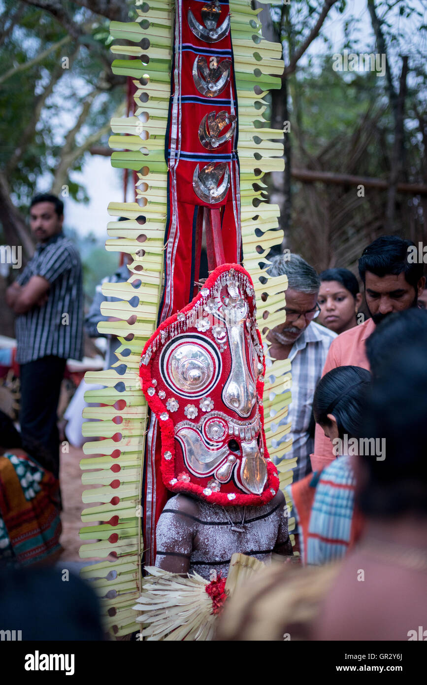 Being blessed by the deity at a Theyyam ritual near Kannur, Kerala, India Stock Photo