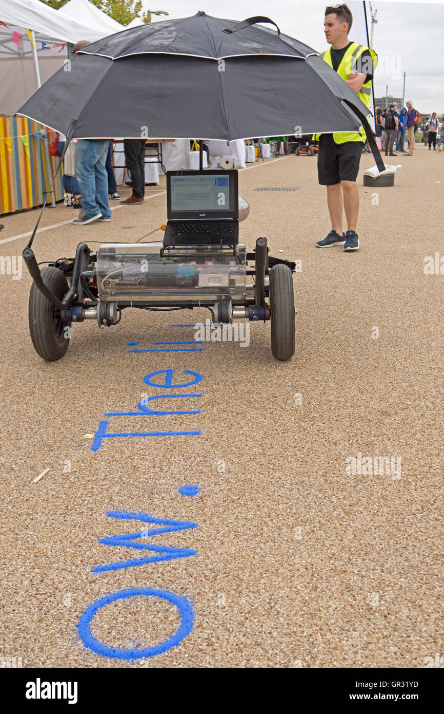 automaton laptop computer printing out lettering on the ground Stock Photo