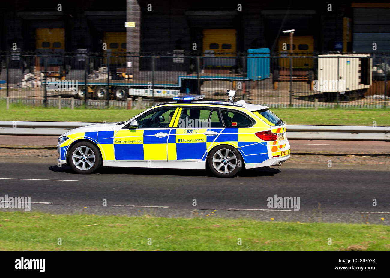 A Police Scotland BMW police car speeding in response to an incident