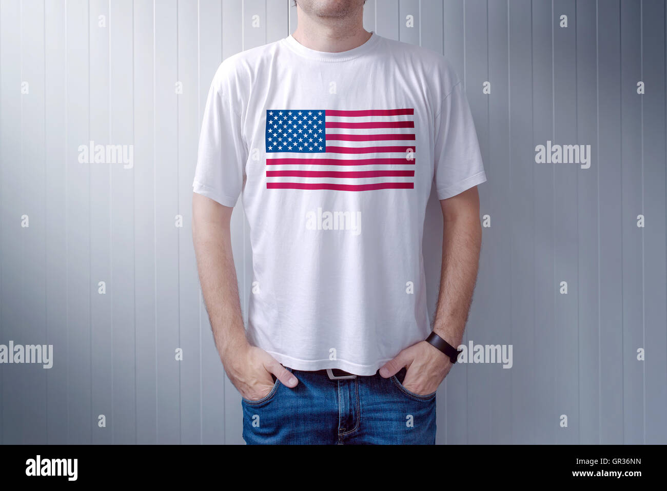 American patriot wearing white shirt with USA flag print, adult male person supporting United States of America Stock Photo