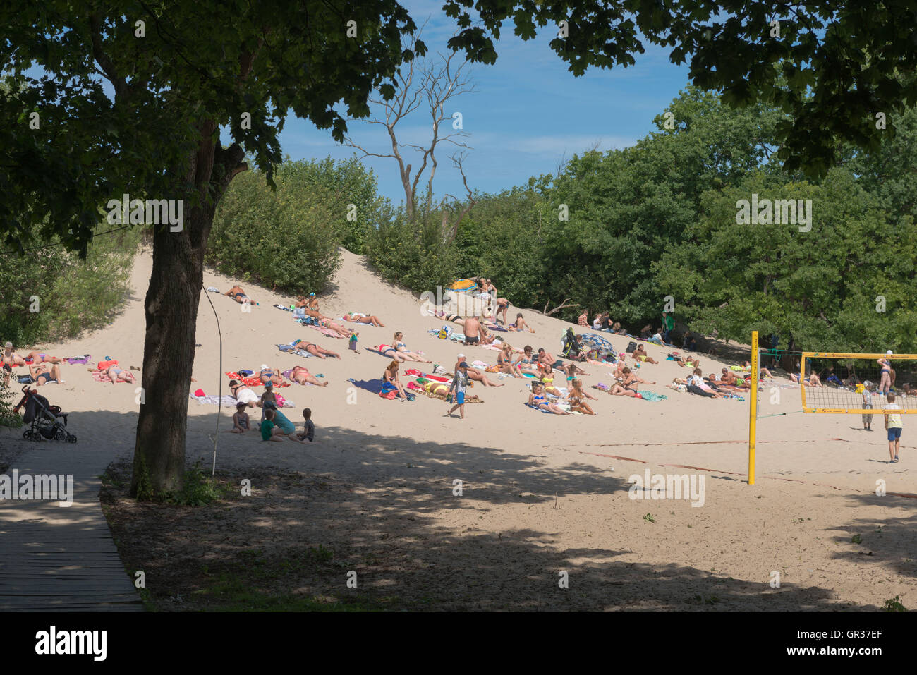 Sunbathing on a dune at the Baltic  seaside-resort  Zelenogradsk, ex Cranz, Kaliningrad Region, Russia, Stock Photo