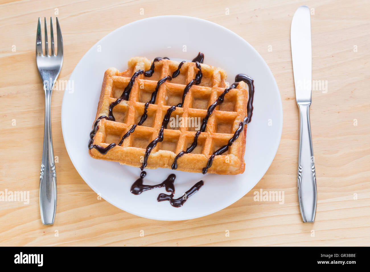 Closeup of a delicious waffle with dark chocolate Stock Photo - Alamy