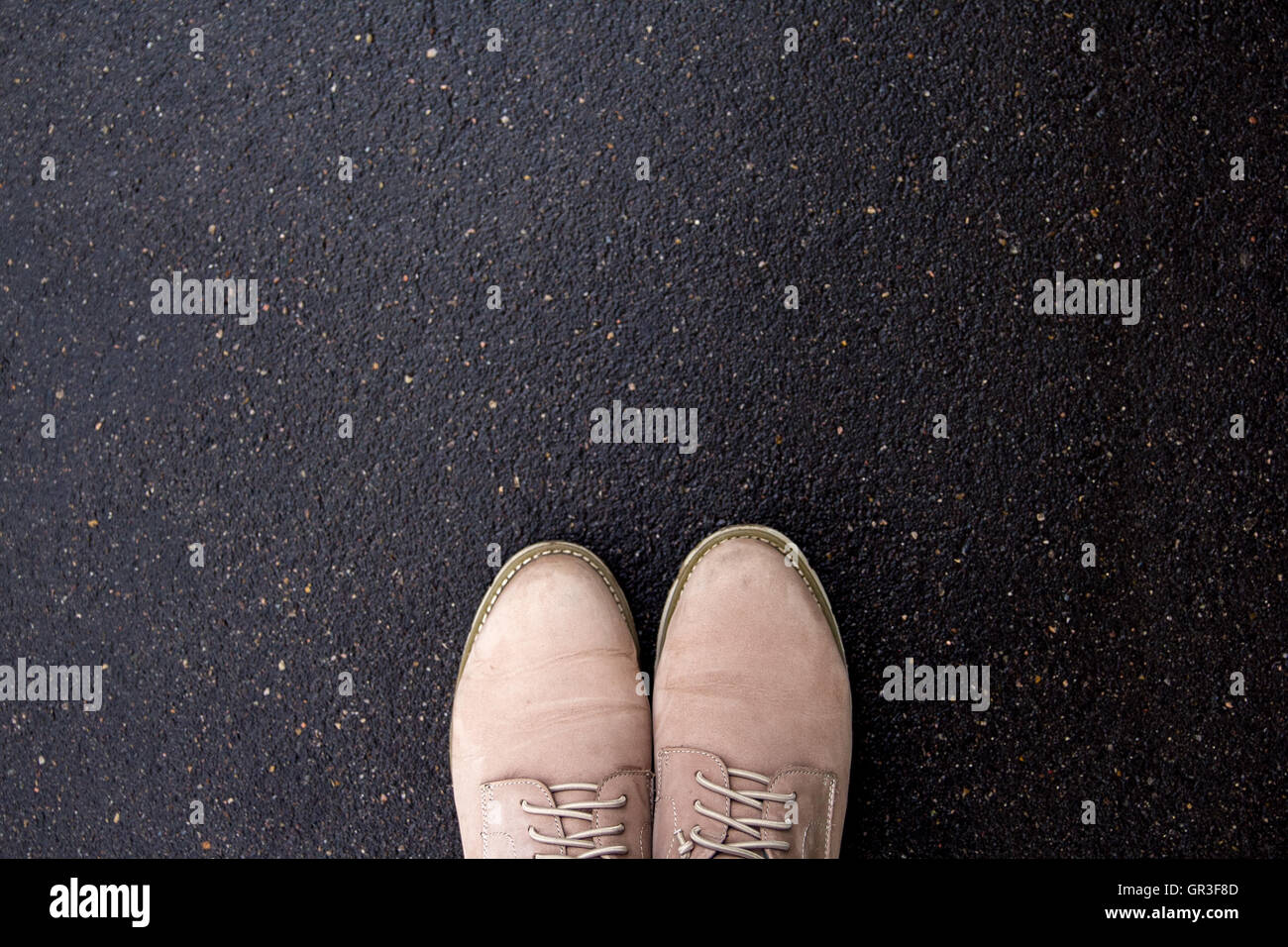 brown shoes on wet pavement, top view Stock Photo Alamy