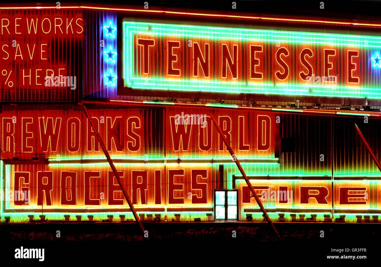 A colorful brightly neon lit Fireworks Retailer does business north of the town of Chattanooga, Tennessee. Stock Photo
