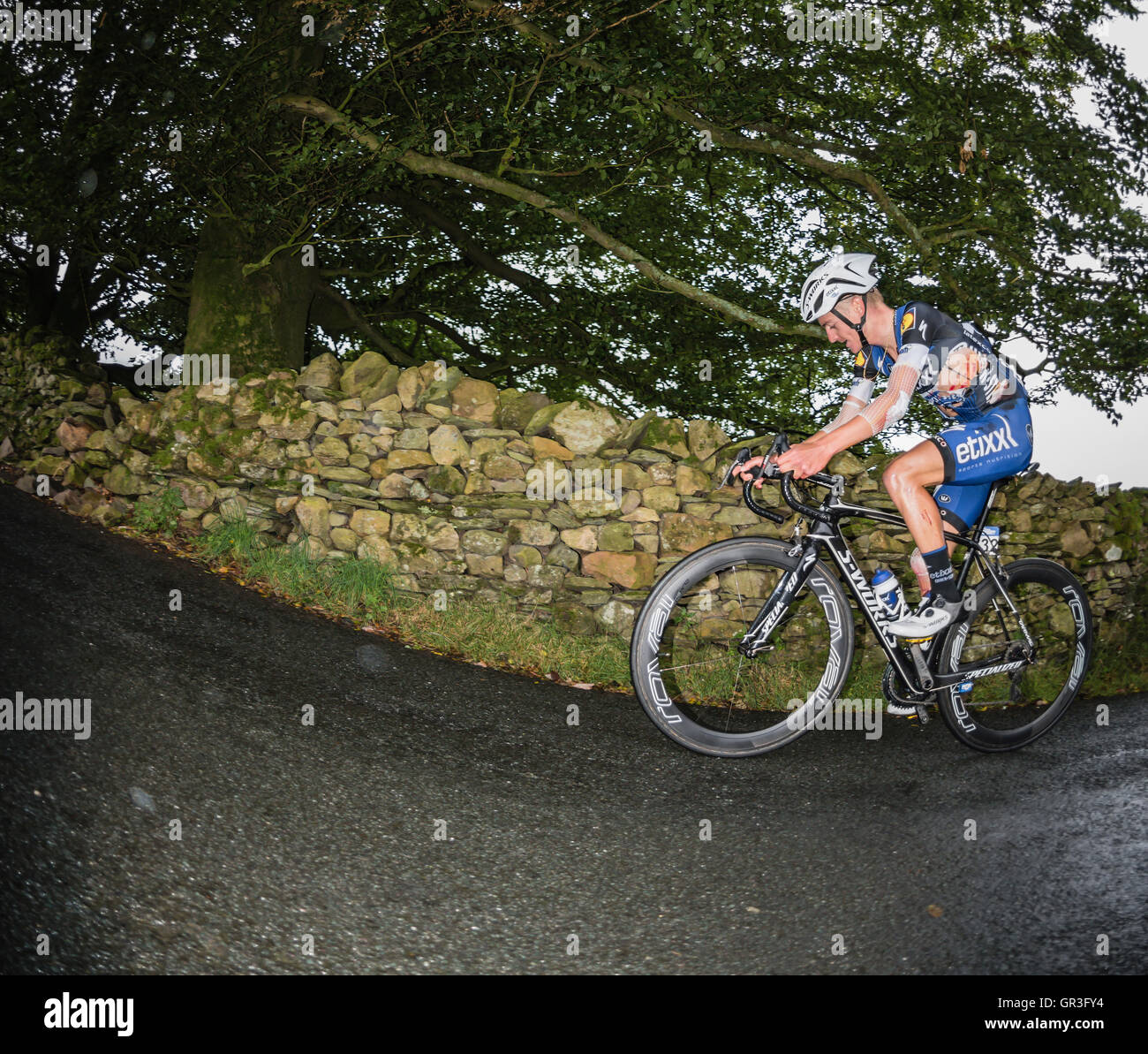 An injured Adrien Costa, Etixx-quick-step, climbing the Struggle on the second stage of the 2016 Tour of Britain cycle race. Stock Photo