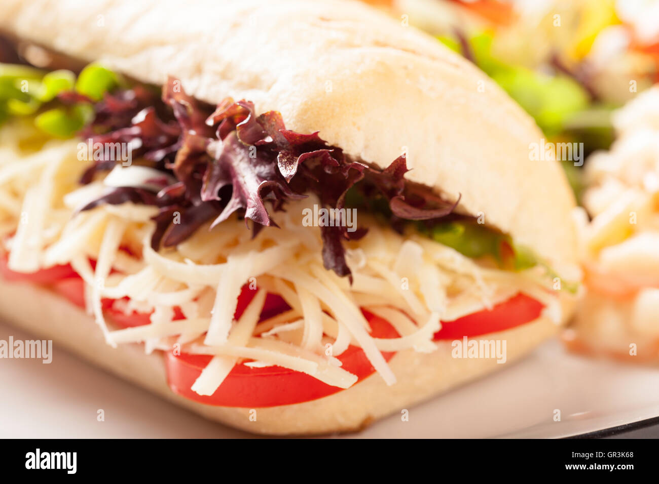 Cheese,tomato,lettuce roll or baguette Stock Photo Alamy