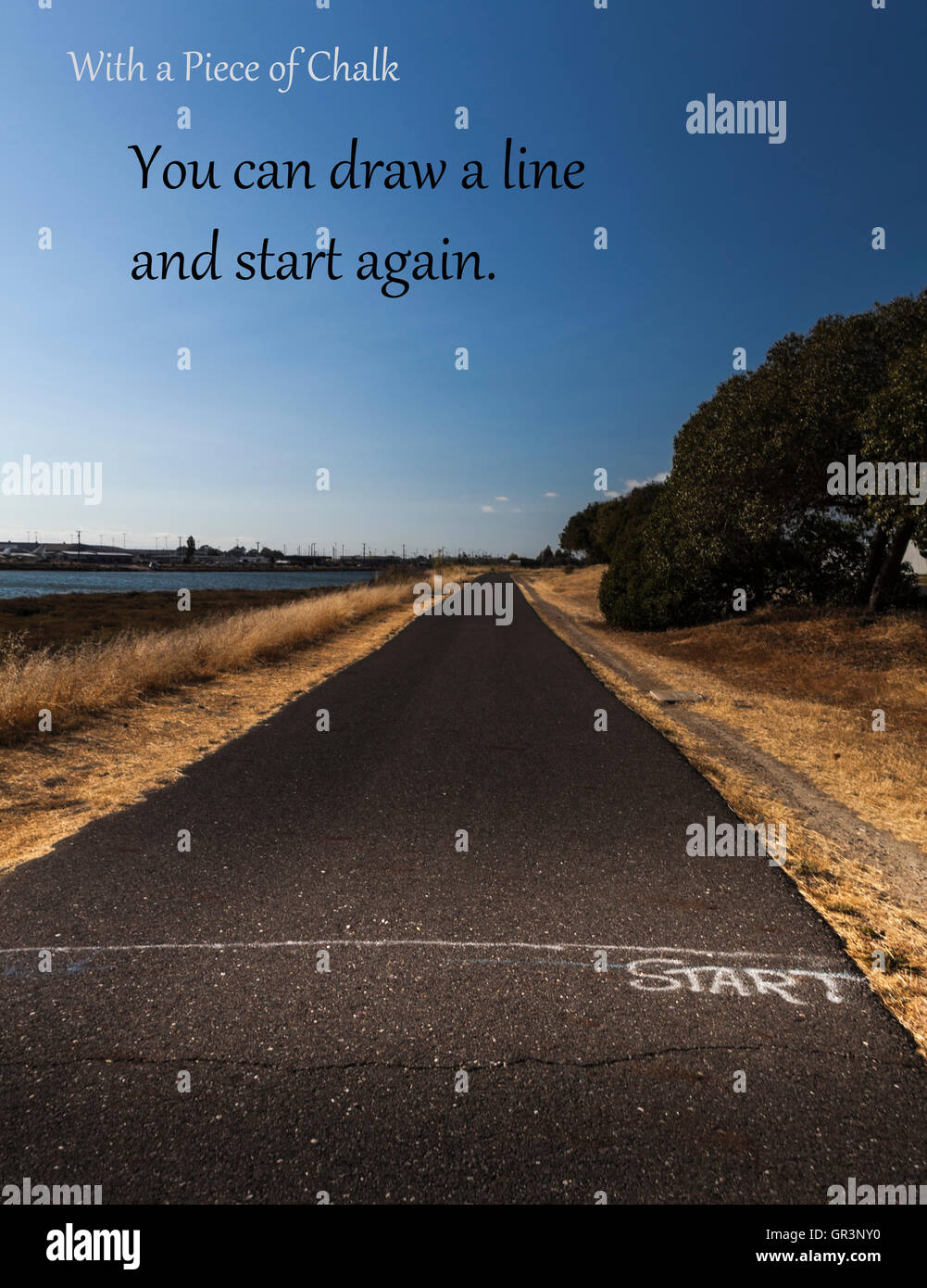 START in chalk on a paved path with added text: 'With a Piece of Chalk - You can draw a line and start again.' Stock Photo